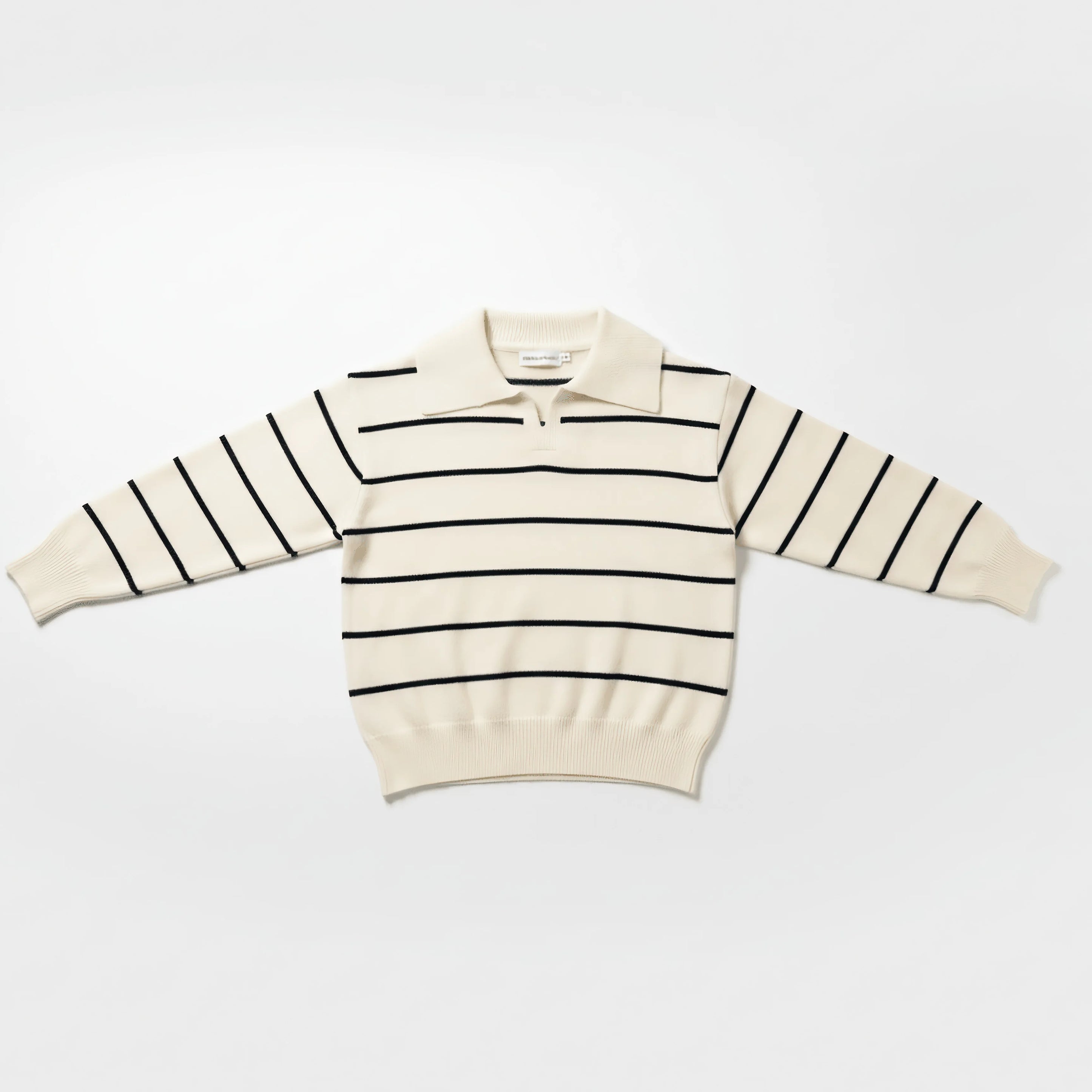 White Bubba's and Mama's sweater with black stripes on a white background