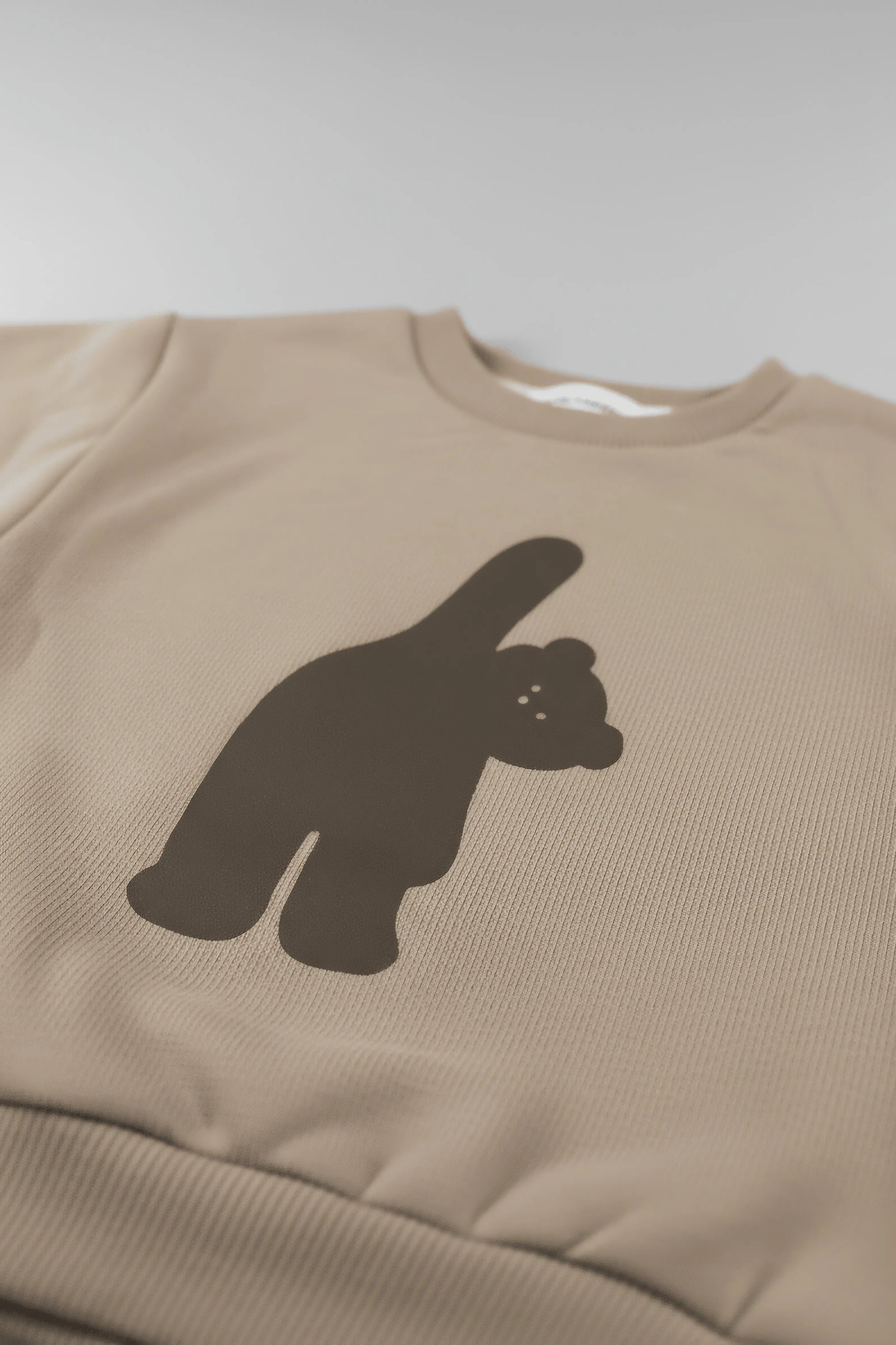 Beige Bubba's and Mama's sweatshirt with a black bear graphic on a light gray background