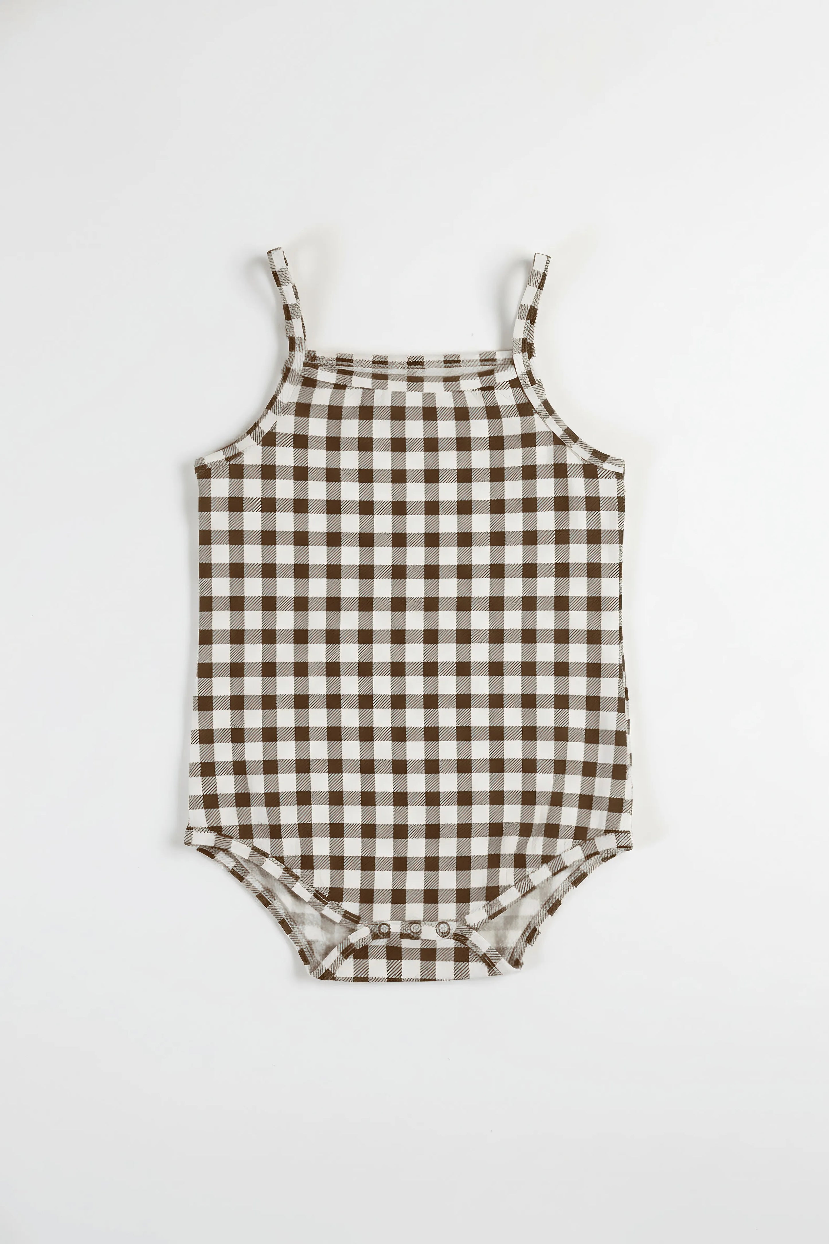 Brown and white checkered romper on a white background