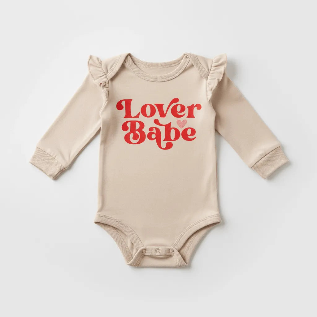 Beige baby onesie with 'Lover Babe' text on a white background