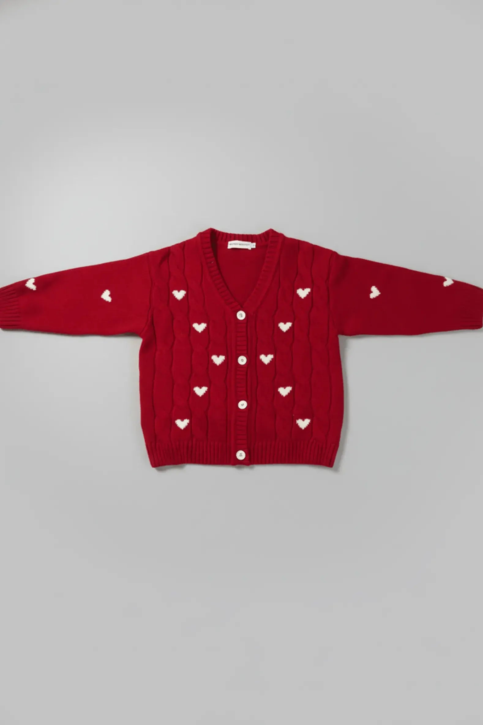 Red Bubba's and Mama's sweater with heart patterns on a gray background