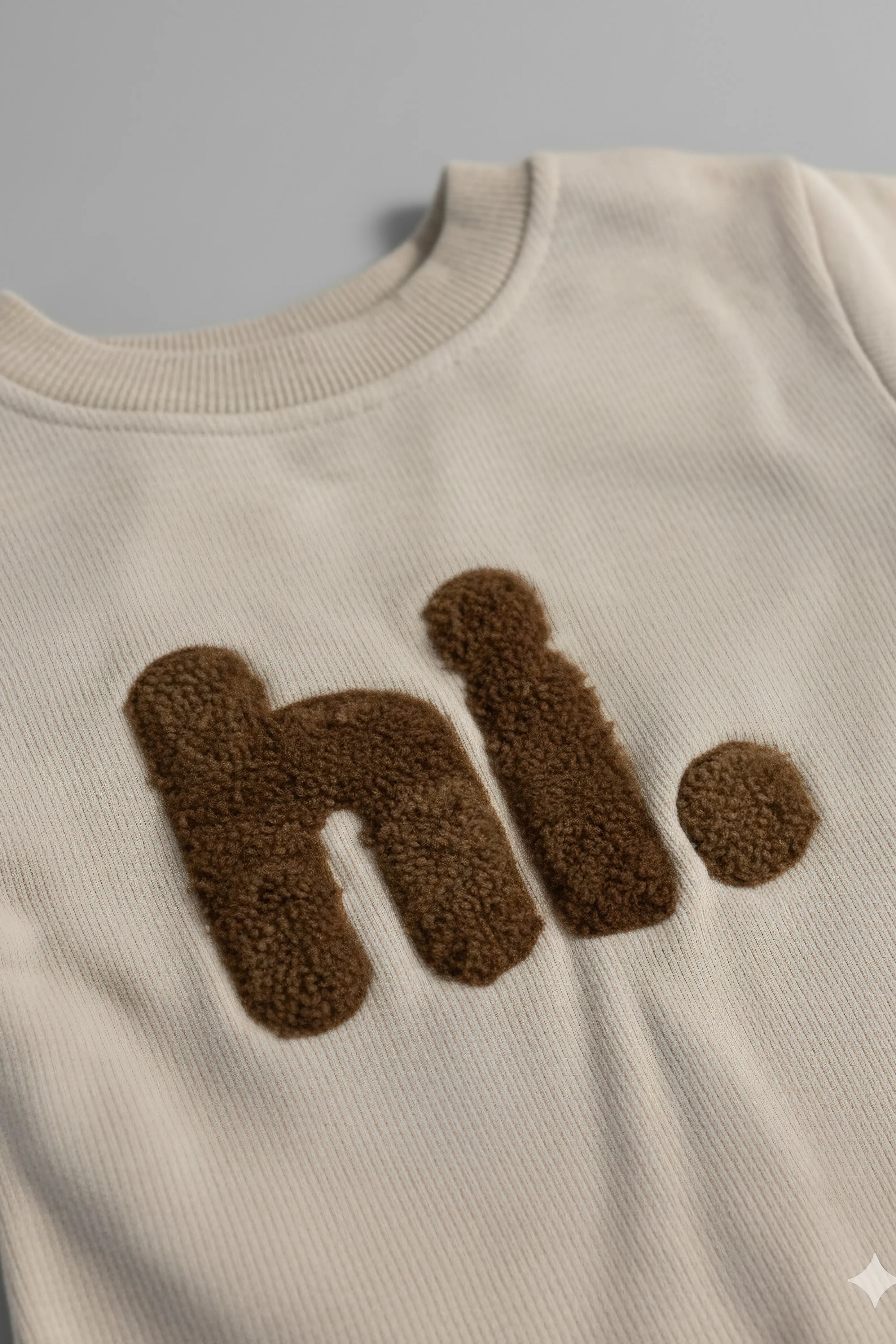 Beige Bubba's and Mama's sweatshirt with brown 'hi.' text on a gray background