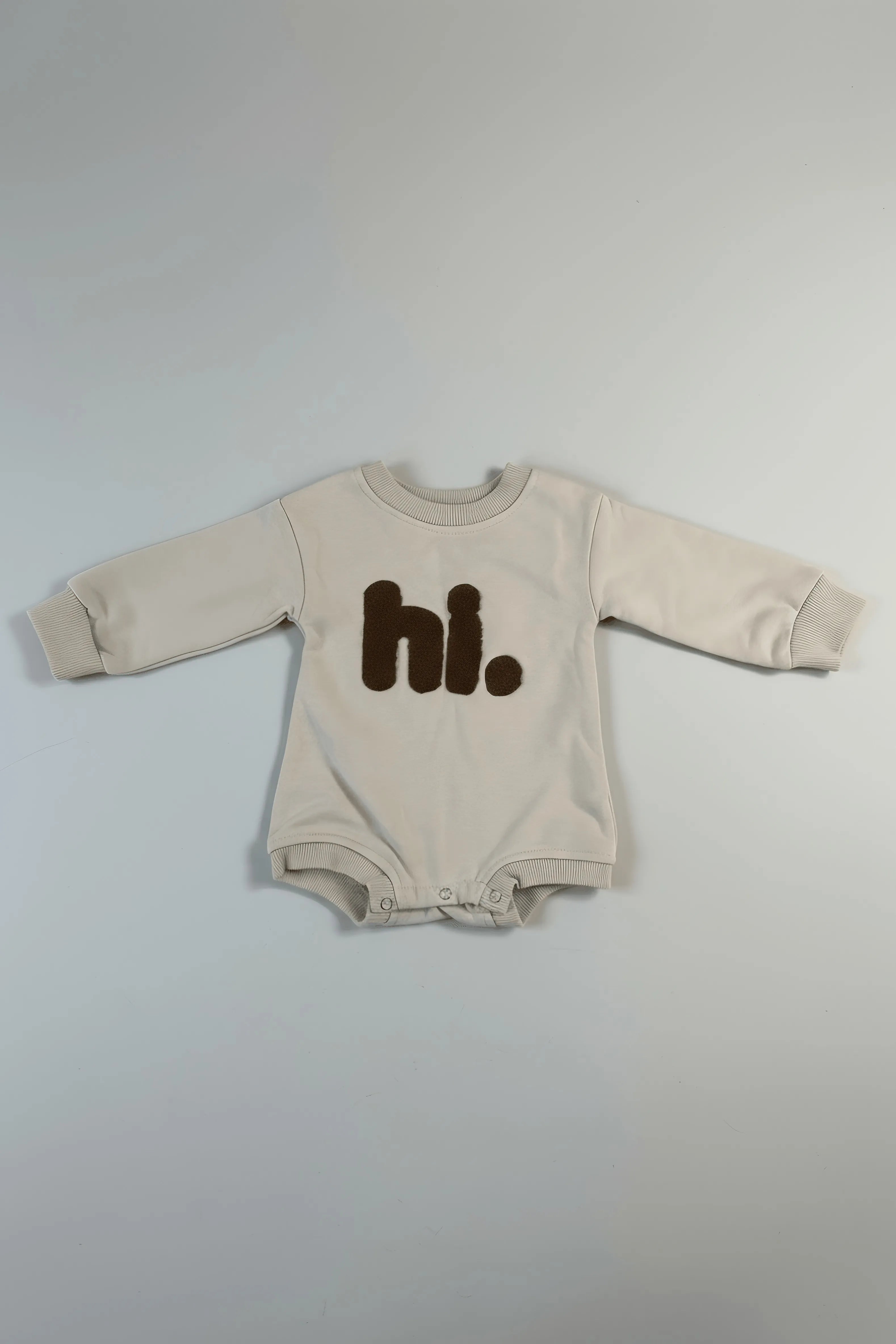 “hi.” Cozy Oatmeal Baby Romper