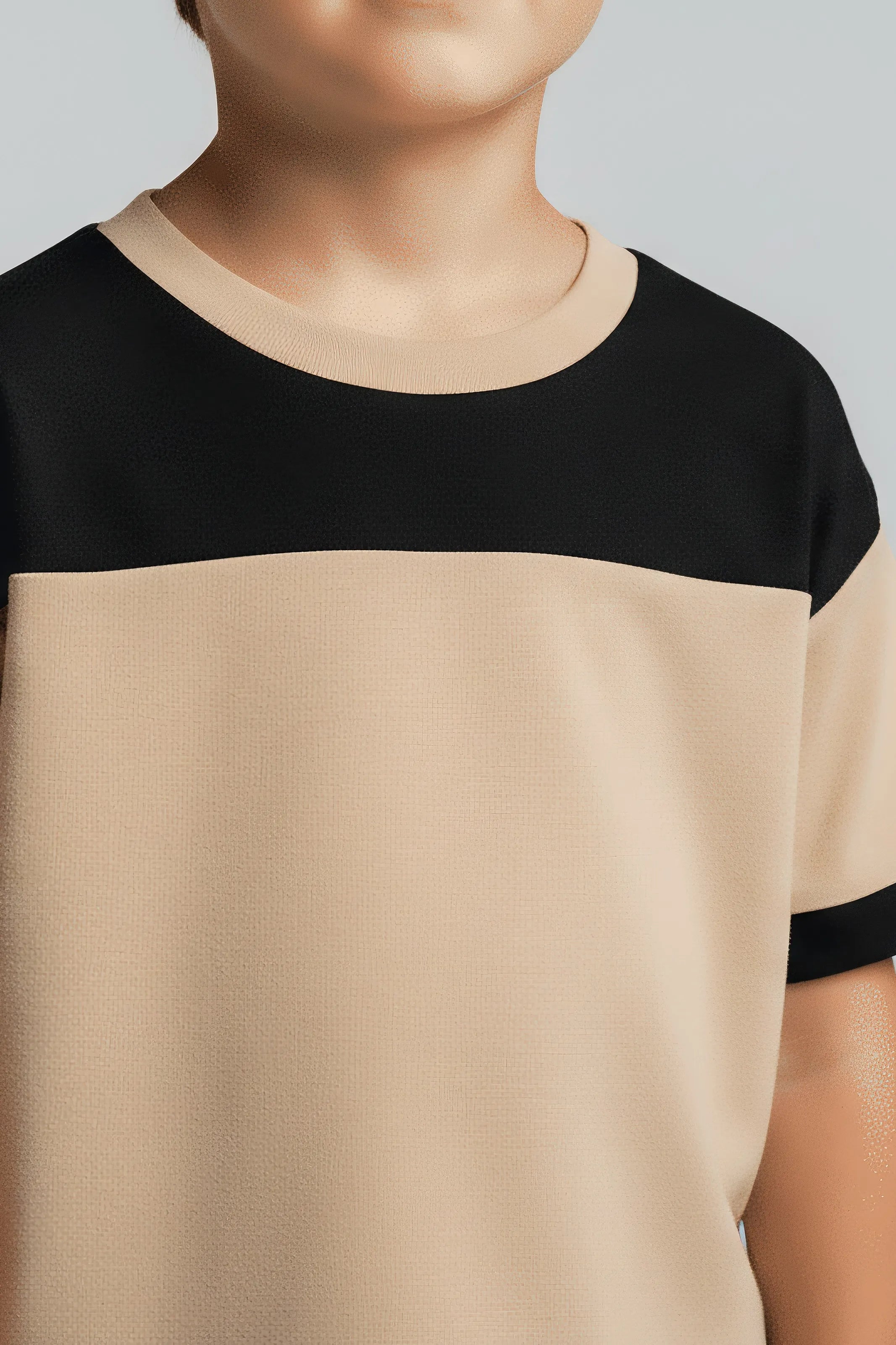 Beige and Bubba's and Mama's black color-blocked top worn by a person on a plain background