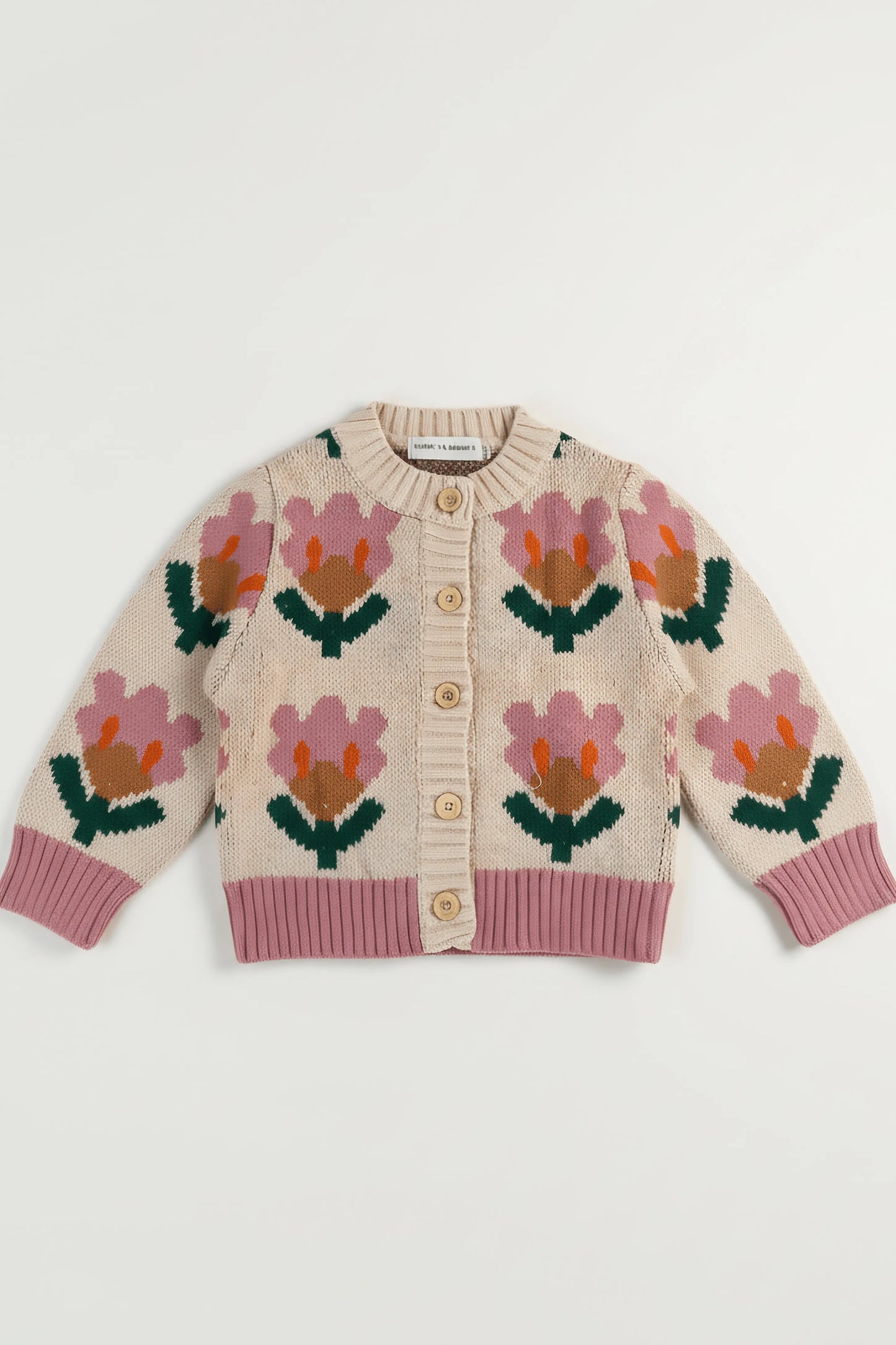 Knitted Bubba's and Mama's cardigan with floral patterns on a white background