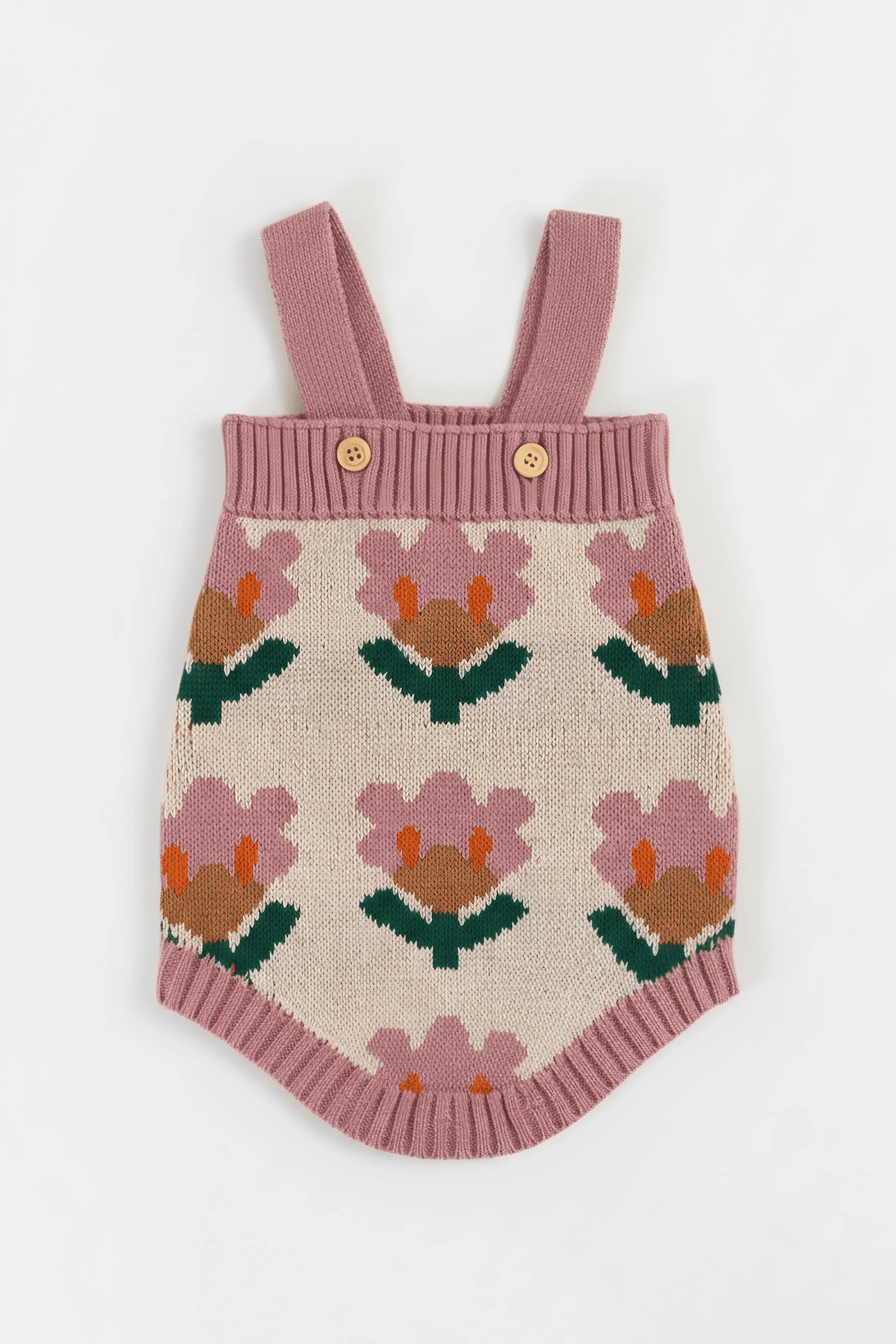 Knitted Bubba's and Mama's romper with floral pattern on a white background