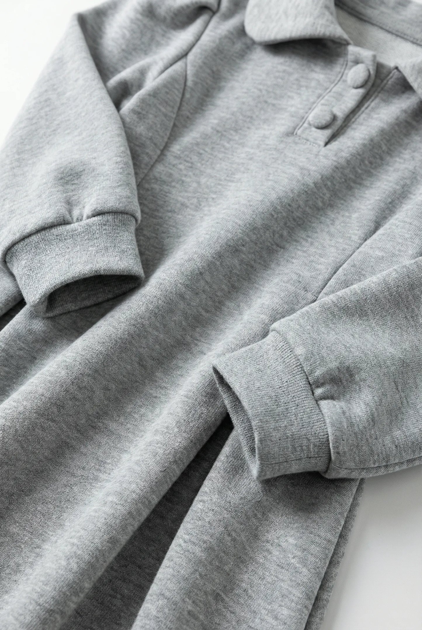 Gray Puff-Sleeve Polo Dress with button details on a white background