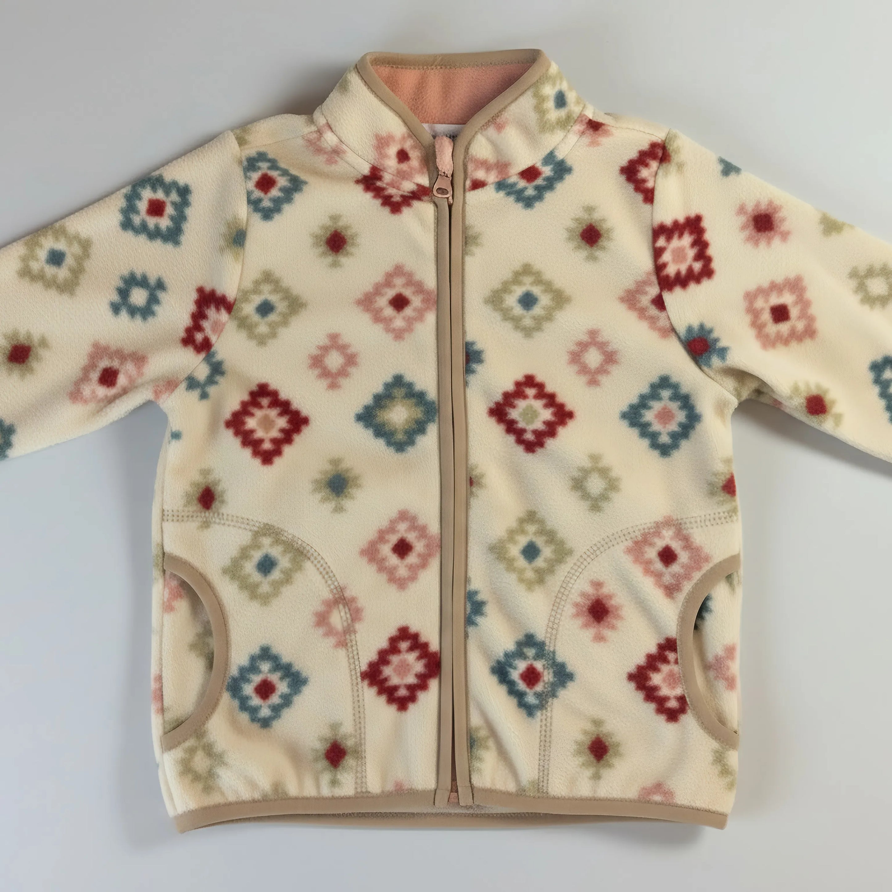Children's Bubba's and Mama's jacket with a colorful geometric pattern on a light gray background