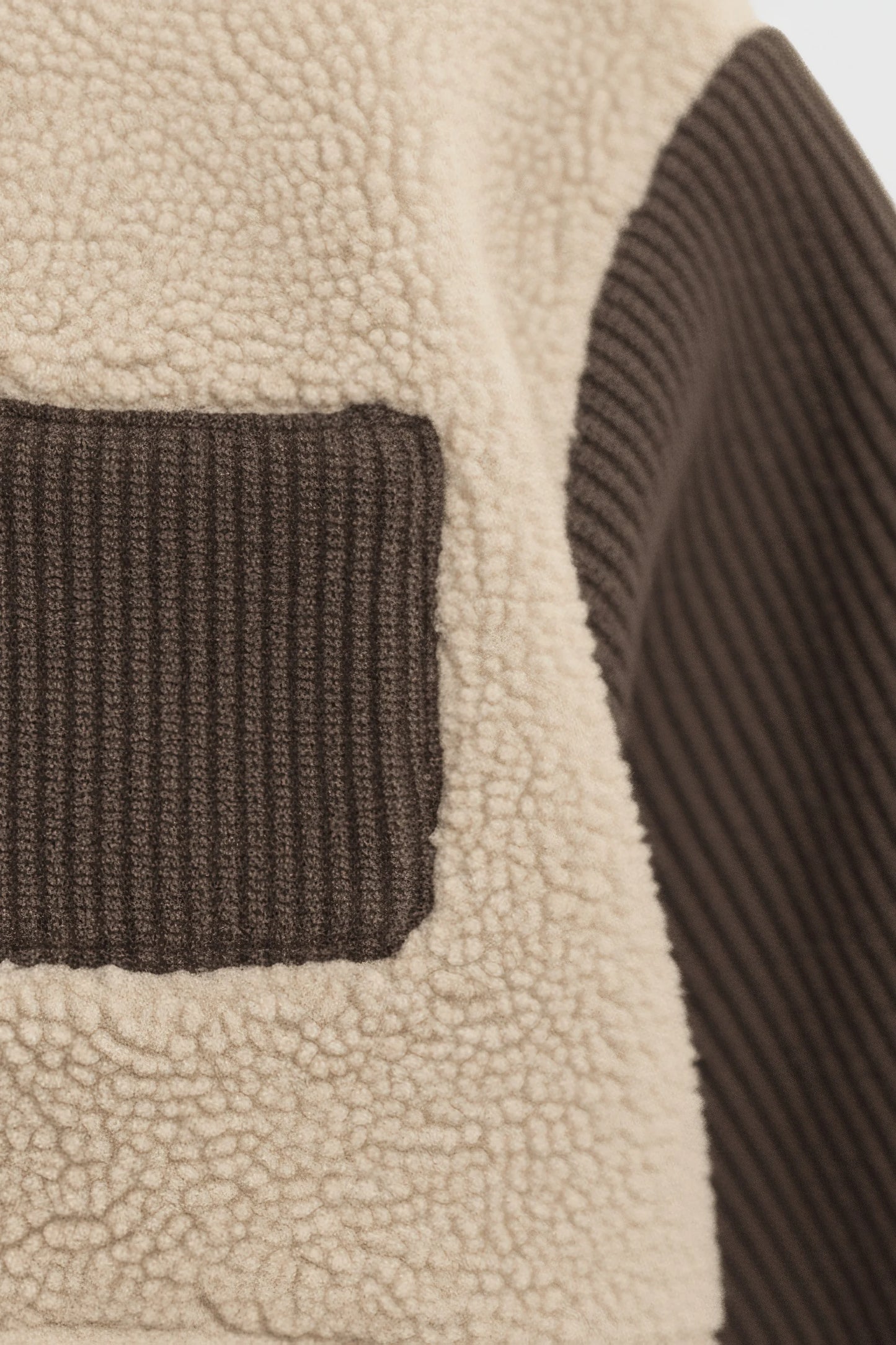 Close-up of a textured fabric with brown and beige colors