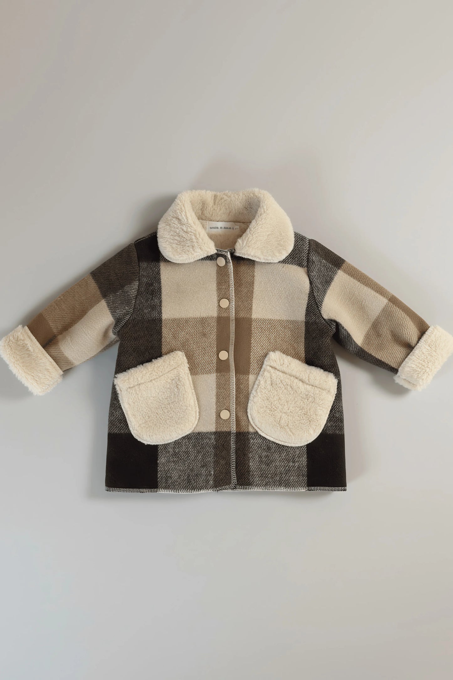 Plaid Bubba's and Mama's jacket with shearling collar and cuffs on a light gray background