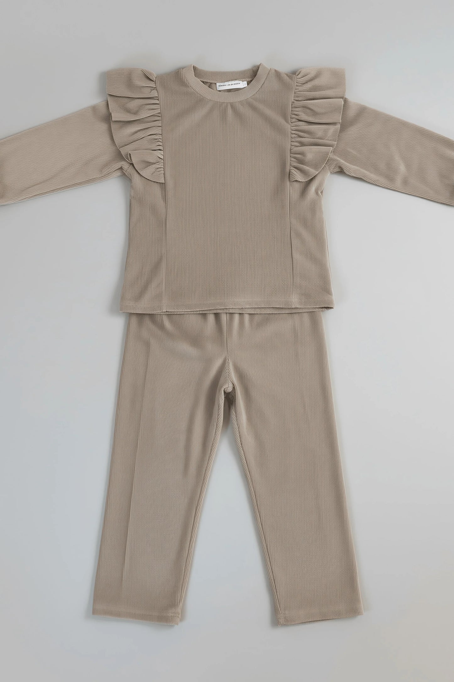 Beige long-sleeve Bubba's and Mama's top and pants set on a light gray background