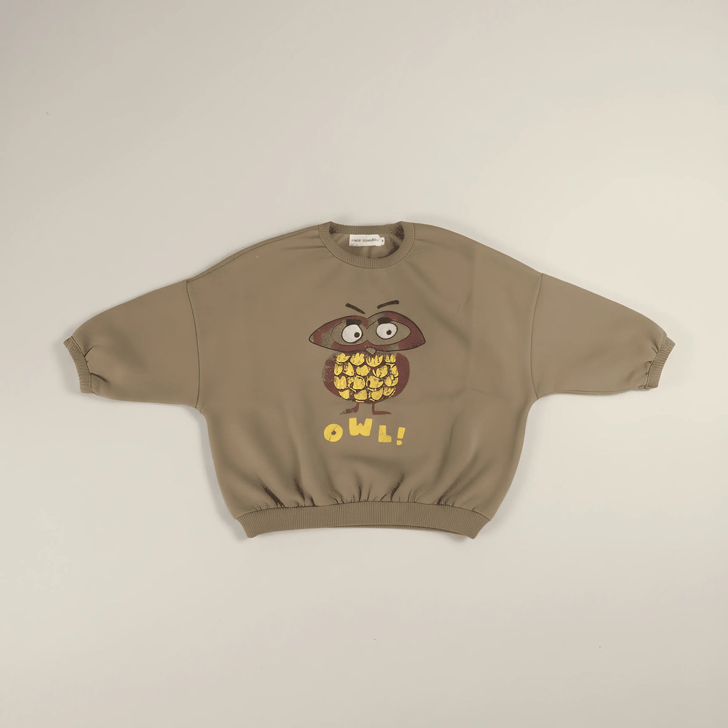 Khaki Bubba's and Mama's sweatshirt with owl design on a beige background
