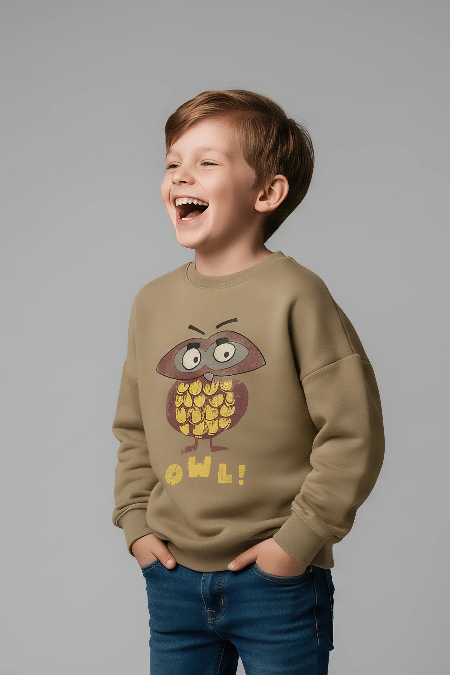 Child wearing a Bubba's and Mama's sweatshirt with an owl design on a gray background