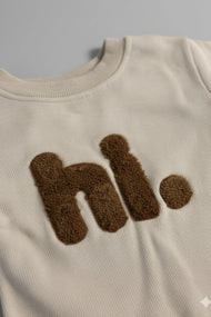 “hi.” Cozy Oatmeal Baby Romper